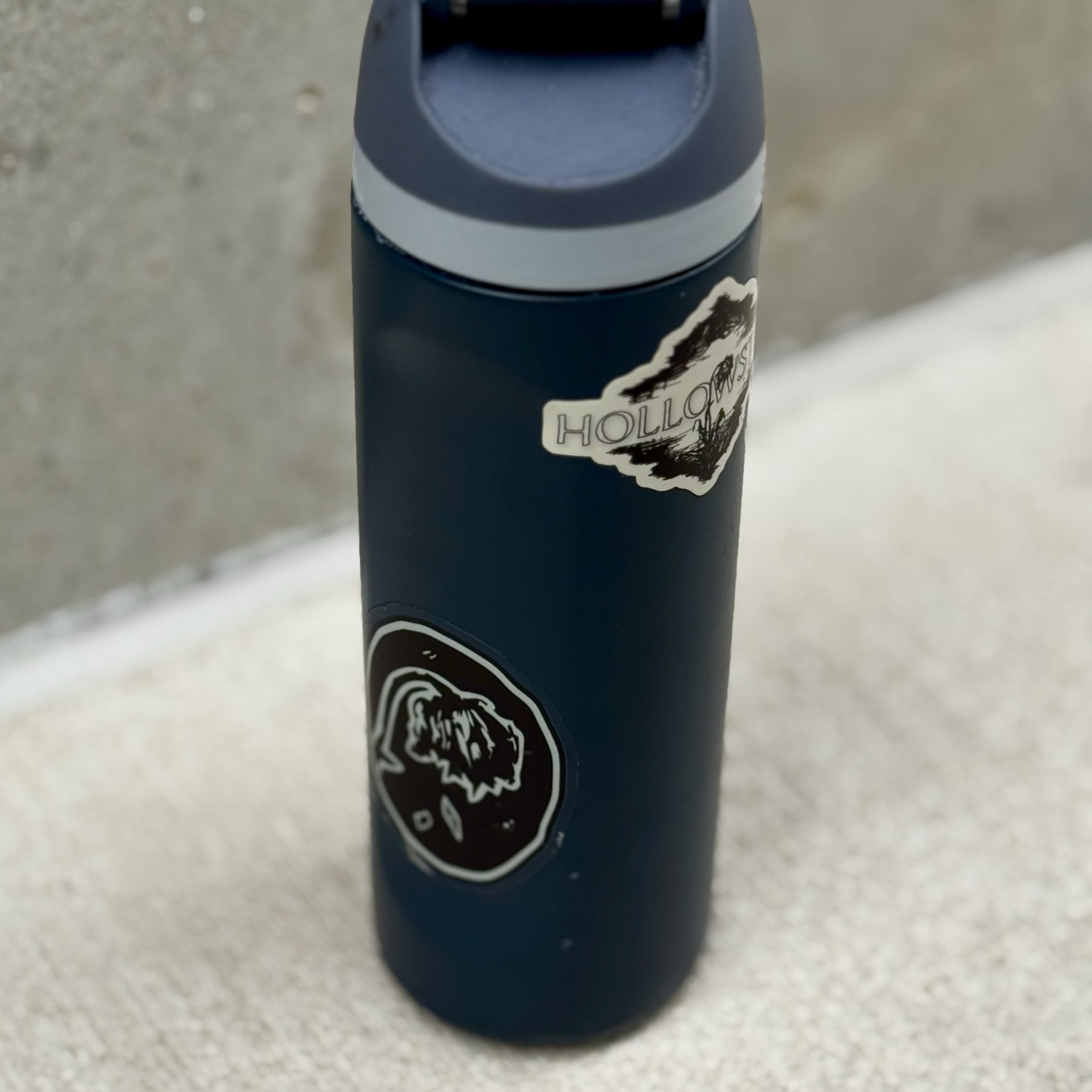 Hollowstem stickers on a bottle